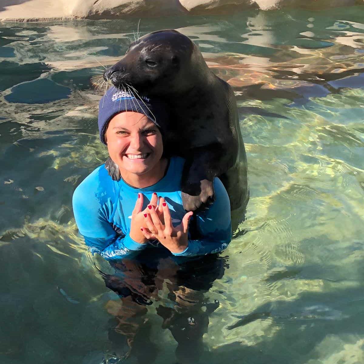 Pet Care Specialist Ally with her sea lion in Key Biscayne