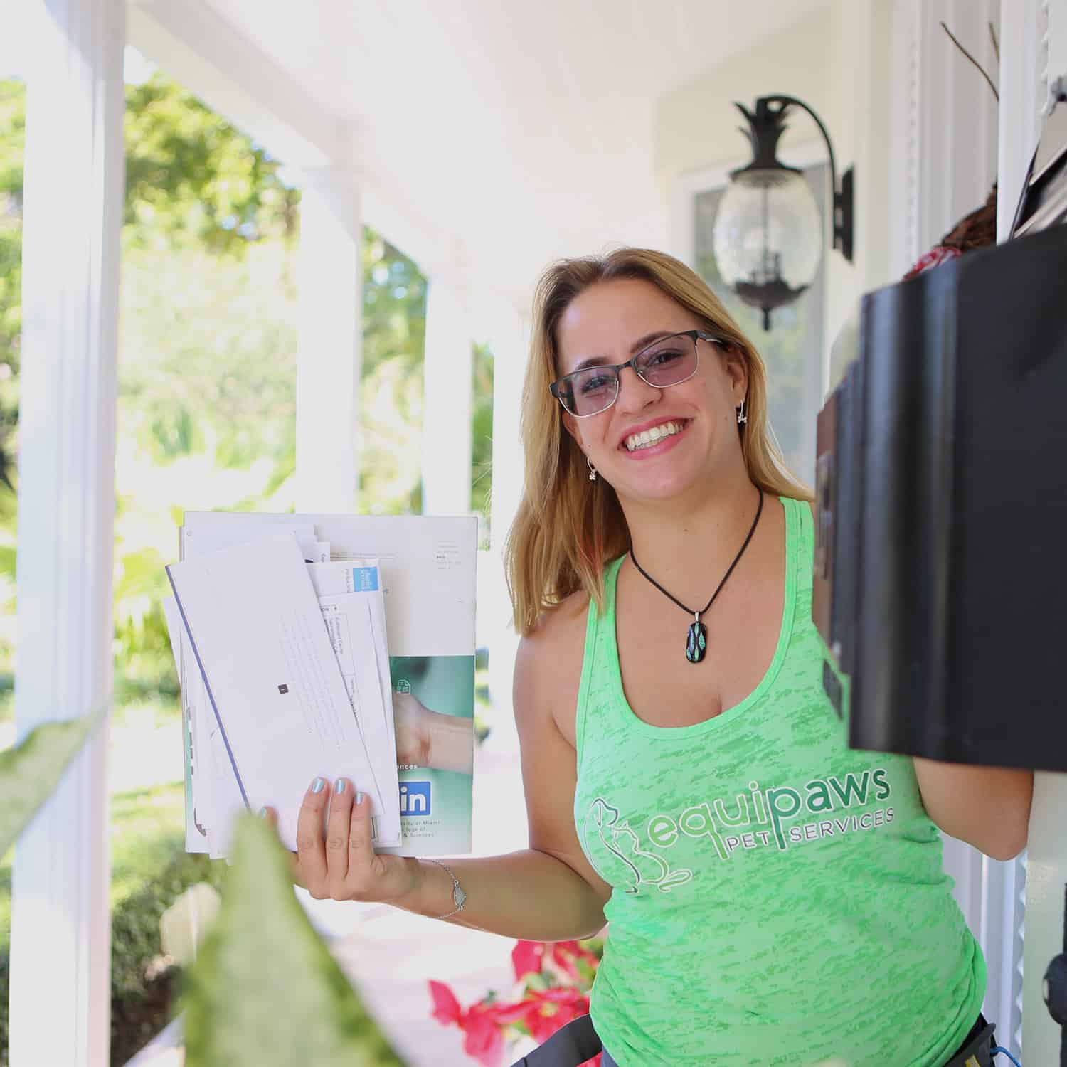 Pet Care Specialist Valerie picking up mail in Coral Gables